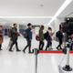 Passengers walk past a thermal scanner upon their arrival at Narita airport on January 17, 2020 in Narita, Japan.